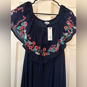 Beautiful off shoulder Navy dress. Beautiful detail!